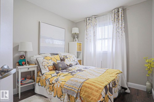 Bedroom featuring wood-finish flooring and light gray wall paint - 1621 64 Street, Edmonton, AB - Indoor Photo Showing Bedroom