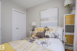 Neutral-toned walls complement white trim and a two-panel closet door - 