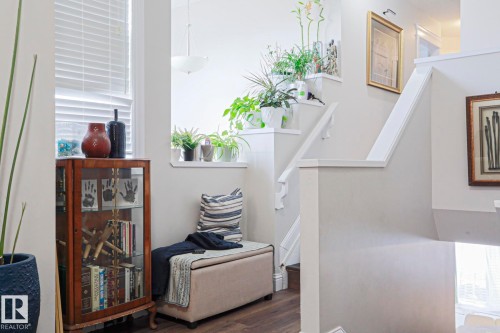 Interior stairway with white painted risers and handrails - 1621 64 Street, Edmonton, AB - Indoor Photo Showing Other Room