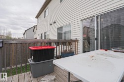 Wood deck featuring a privacy fence - 