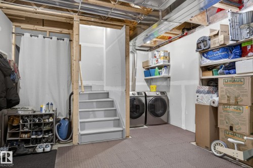 Utility area featuring unfinished walls, exposed ceiling joists, and concrete flooring - 16 7503 Getty Gate, Edmonton, AB - Indoor Photo Showing Other Room