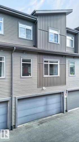 Contemporary multi-level exterior featuring horizontal and vertical siding - 16 7503 Getty Gate, Edmonton, AB - Outdoor