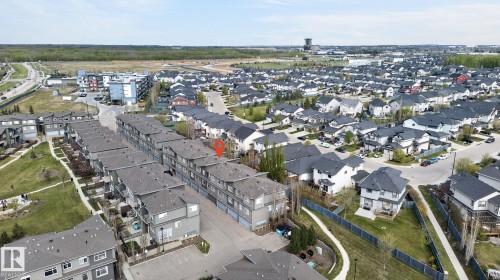 Aerial view of a residential community featuring townhomes and detached properties - 16 7503 Getty Gate, Edmonton, AB - Outdoor With View