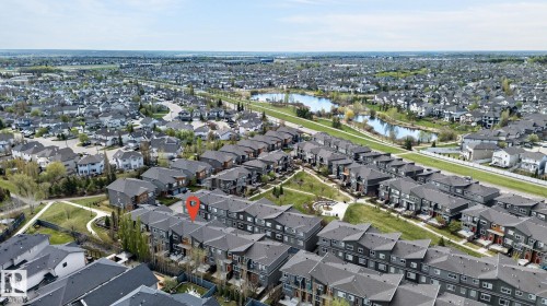 Aerial perspective showcasing a residential area with varied housing styles - 16 7503 Getty Gate, Edmonton, AB - Outdoor With View