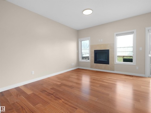 15926 10 Avenue Sw, Edmonton, AB - Indoor Photo Showing Living Room With Fireplace