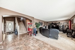 Entryway featuring decorative glass front door. . - 