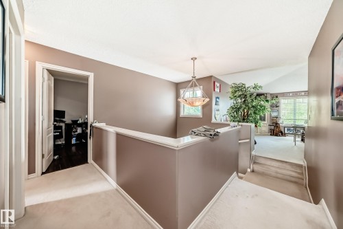 Interior landing featuring carpeted flooring and neutral wall tones - 5107 200 Street, Edmonton, AB - Indoor Photo Showing Other Room