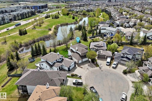 White-sided residence with multiple gables and a multi-level deck, situated on a cul-de-sac - 5107 200 Street, Edmonton, AB - Outdoor With View