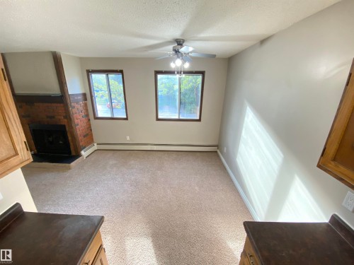 203 10826 113 Street, Edmonton, AB - Indoor Photo Showing Other Room With Fireplace