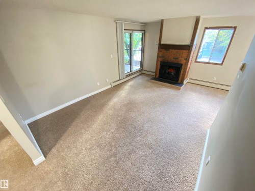 203 10826 113 Street, Edmonton, AB - Indoor Photo Showing Other Room With Fireplace