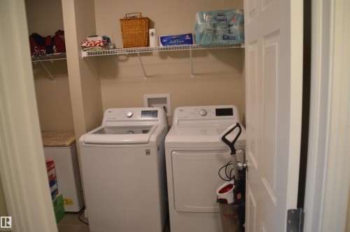 Dedicated laundry area with durable flooring - 1412 152, Edmonton, AB - Indoor Photo Showing Laundry Room