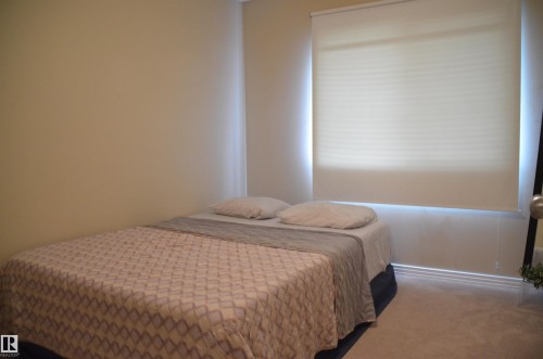 Neutral-toned wall finishes - 1412 152, Edmonton, AB - Indoor Photo Showing Bedroom