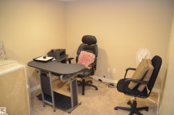 Neutral-toned walls complement the light-colored carpet, creating a versatile interior space - 