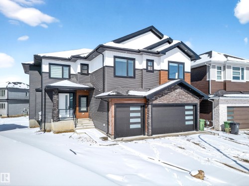 The property features a contemporary exterior with multi-toned siding and brick accents - 6614 39 Avenue, Beaumont, AB - Outdoor With Facade