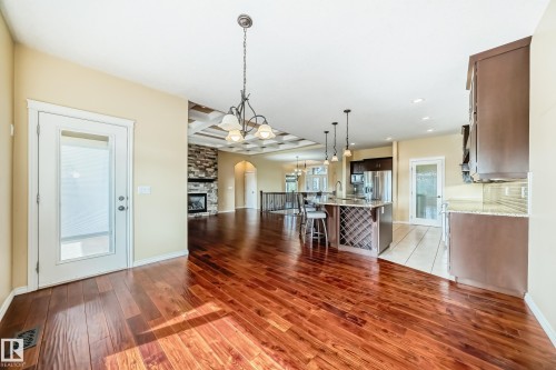 Wood-finish flooring throughout the main living areas - 527 Callaghan Point(E), Edmonton, AB - Indoor