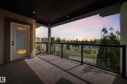 Covered balcony with glass railings and dark-finish decking - 