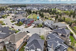 Residential development featuring varied architectural styles and dark-shingled roofs - 
