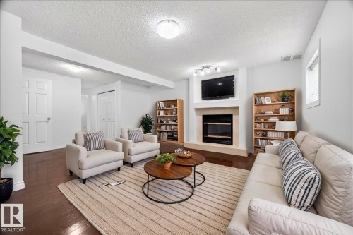 3671 33 Street, Edmonton, AB - Indoor Photo Showing Living Room With Fireplace