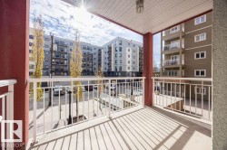 Concrete balcony with white metal railings - 