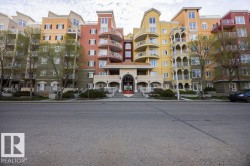 Multi-story residential building featuring varied architectural styles and a colorful facade - 