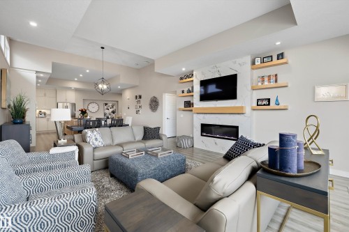 166 Edgewater Circle, Leduc, AB - Indoor Photo Showing Living Room With Fireplace