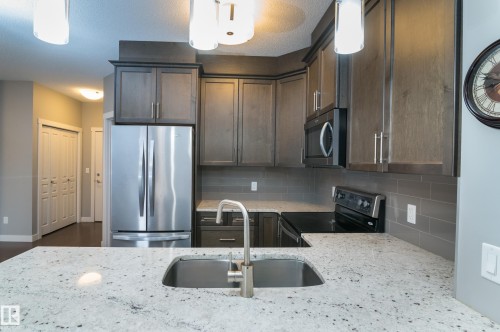 414 2207 44 Avenue, Edmonton, AB - Indoor Photo Showing Kitchen With Stainless Steel Kitchen With Double Sink With Upgraded Kitchen