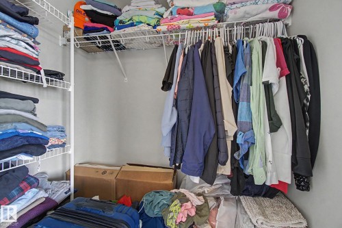 Closet featuring wire shelving and a hanging rod for organization - 17 320 Secord Boulevard, Edmonton, AB - Indoor With Storage