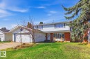 Two-story residence featuring white siding and red brick accents - 17604 85 Avenue, Edmonton, AB  - Outdoor 