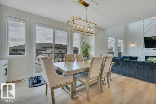 38 Avonlea Way, Spruce Grove, AB - Indoor Photo Showing Dining Room With Fireplace