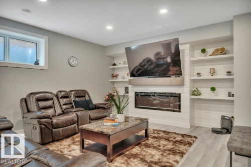 38 Avonlea Way, Spruce Grove, AB - Indoor Photo Showing Living Room With Fireplace