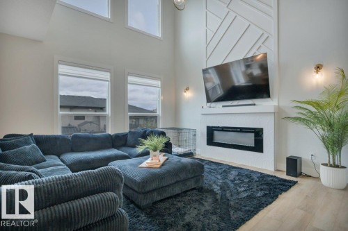 38 Avonlea Way, Spruce Grove, AB - Indoor Photo Showing Living Room With Fireplace