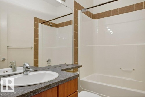 Bathroom featuring a tub/shower combination. - 223 10121 80 Avenue, Edmonton, AB - Indoor Photo Showing Bathroom
