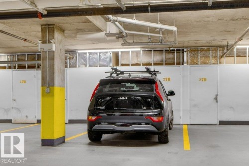 One titled underground parking stall in heated parkade with individual storage locker. - 223 10121 80 Avenue, Edmonton, AB - Indoor Photo Showing Garage