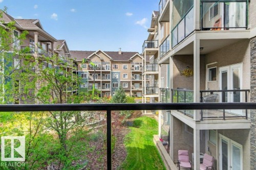 Balcony overlooking the courtyard and fountain. - 223 10121 80 Avenue, Edmonton, AB - Outdoor With Balcony