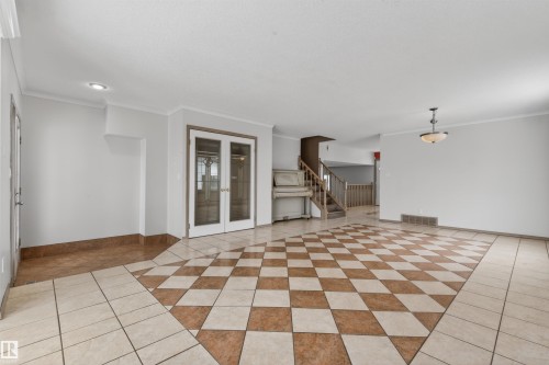 Spacious interior featuring a large tiled floor with a checkered pattern - 3917 52 Avenue, Cold Lake, AB - Indoor Photo Showing Other Room