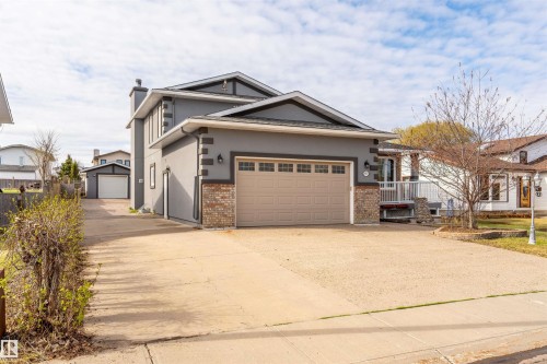 Contemporary gray stucco exterior with brick accents - 3917 52 Avenue, Cold Lake, AB - Outdoor