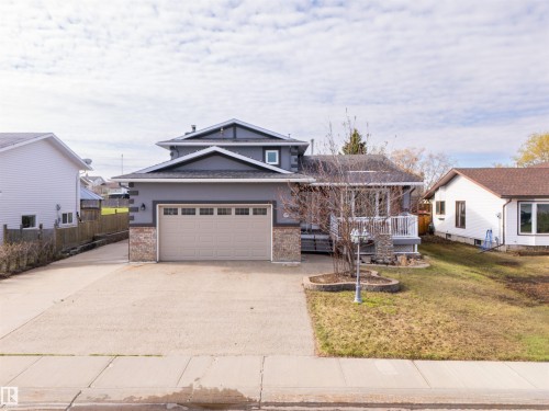 Two-story home with a light gray exterior, featuring a stone veneer accent - 3917 52 Avenue, Cold Lake, AB - Outdoor