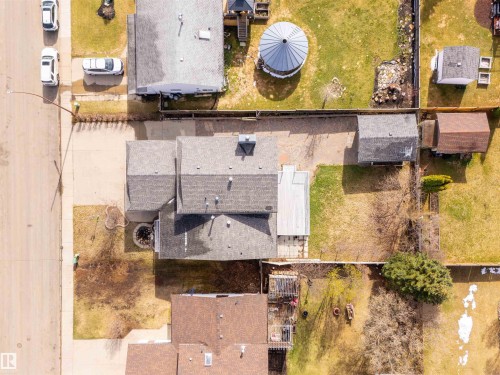 Property featuring a multi-gabled roofline, an attached single-car garage, and a rear deck - 3917 52 Avenue, Cold Lake, AB - Outdoor