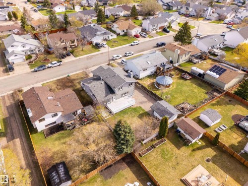 Expansive property with a multi-level structure featuring a light gray exterior and dark gray shingle roofing - 3917 52 Avenue, Cold Lake, AB - Outdoor With View