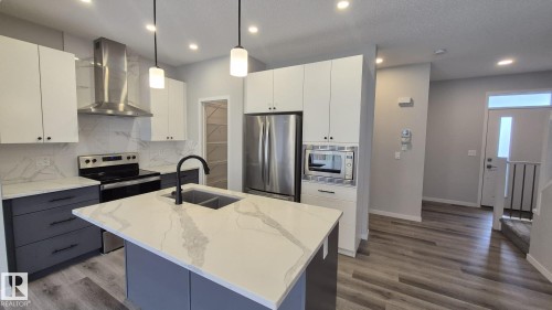 5120 23 Avenue, Edmonton, AB - Indoor Photo Showing Kitchen With Stainless Steel Kitchen With Double Sink With Upgraded Kitchen
