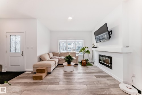 6620 46 Avenue, Beaumont, AB - Indoor Photo Showing Living Room With Fireplace