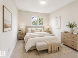 Bright room featuring a window with white trim, light-colored walls, and neutral carpeting - 