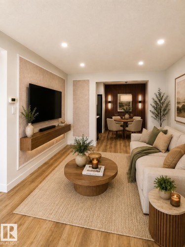 Open-concept living space featuring wood-finish flooring and recessed ceiling lighting - 224 Callingwood Two Two, Edmonton, AB - Indoor Photo Showing Living Room