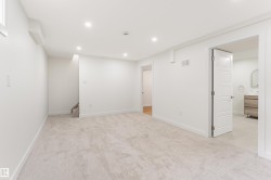 Spacious room featuring light-toned carpet flooring and recessed lighting - 