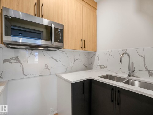 11 Dalquist Bay, Leduc, AB - Indoor Photo Showing Kitchen With Double Sink
