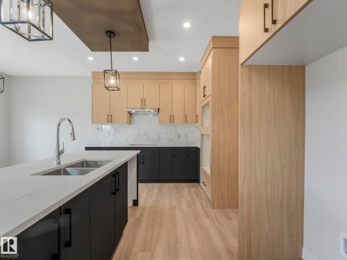 11 Dalquist Bay, Leduc, AB - Indoor Photo Showing Kitchen With Double Sink