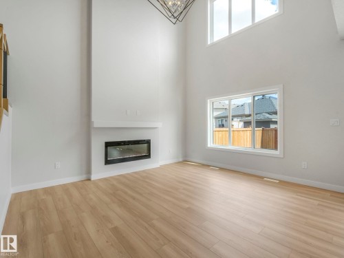 11 Dalquist Bay, Leduc, AB - Indoor Photo Showing Living Room With Fireplace
