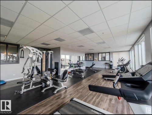 Fitness center featuring treadmills, weight machines, and free weights - 531 5151 Windermere Boulevard, Edmonton, AB - Indoor Photo Showing Gym Room