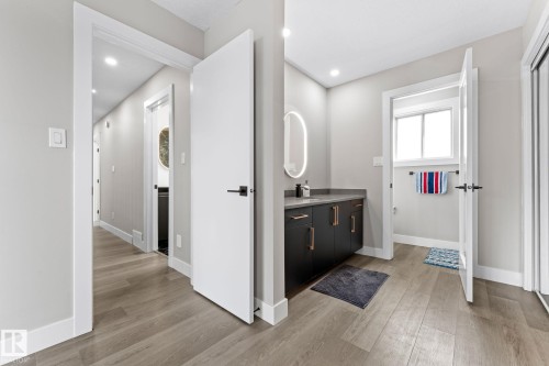 Hallway featuring wood-finish flooring and recessed lighting - 10673 161 Avenue, Edmonton, AB - Indoor Photo Showing Other Room