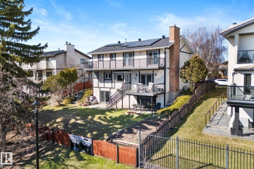 Two-story residence featuring multiple balconies, a lower-level patio, and solar panels - 10673 161 Avenue, Edmonton, AB - Outdoor With Balcony